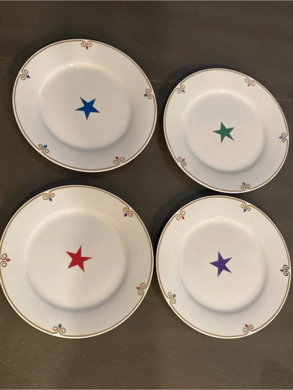 Pier 1 White  Plates with Multicolor Star Accents and Gold Trim